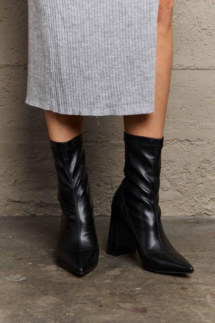 Woman Wearing Black Stacy Block Heel Sock Boots