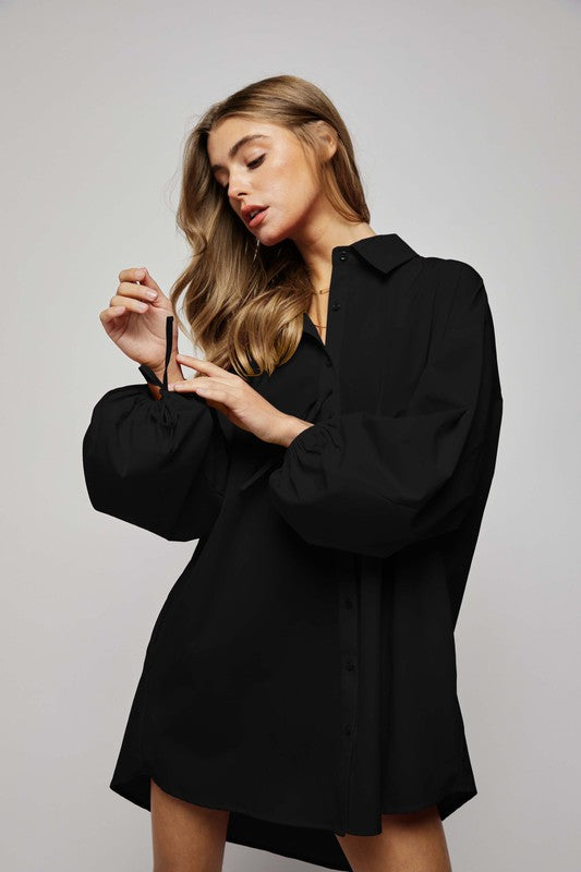 women wearing a black Puff sleeves and buttons placket - relax fit shirts dress with side pockets. Variety of colors.