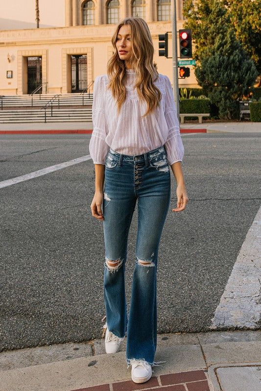 Woman wearing High Rise Distressed Raw Hem Flare