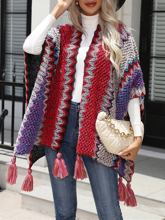 woman wearing a Multi-Colored Striped Open Front Poncho with Tassels