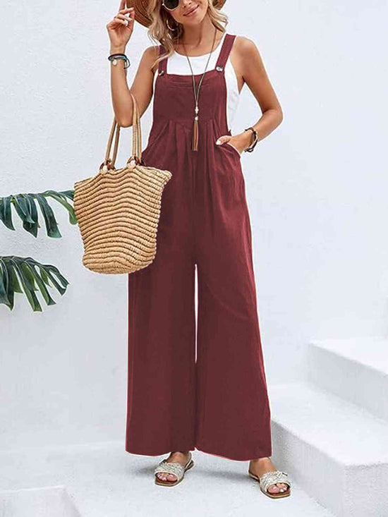 Woman wearing a wine Full Size Wide Leg Overalls with Pockets