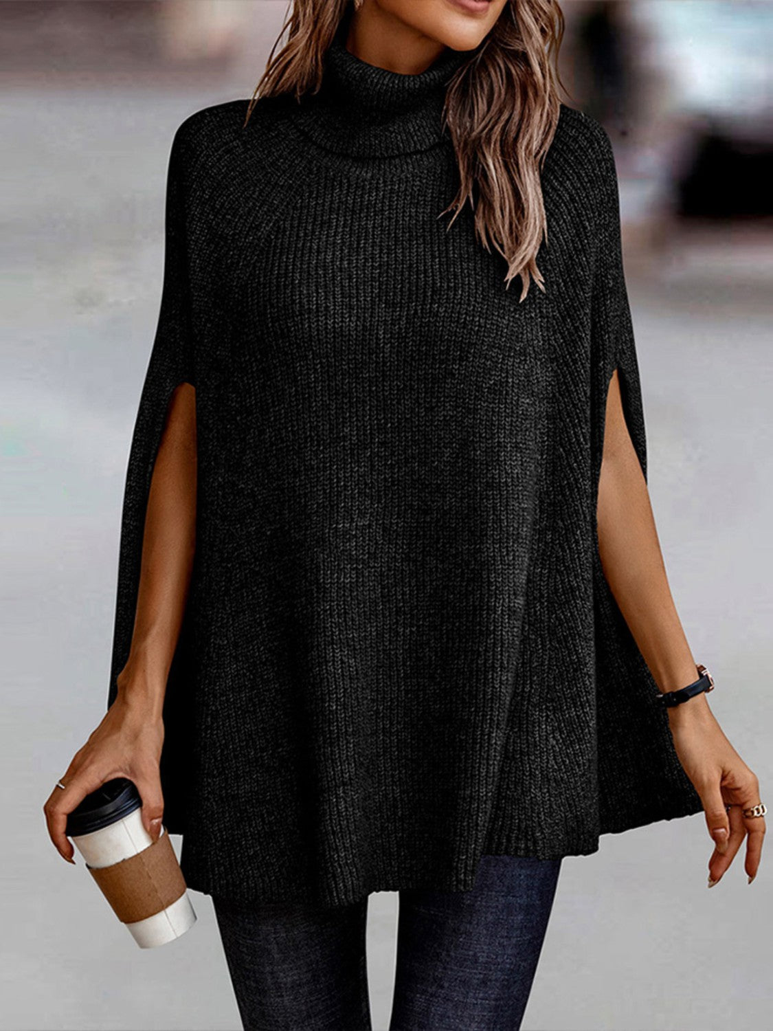 woman wearing a black Turtleneck Dolman Sleeve Poncho